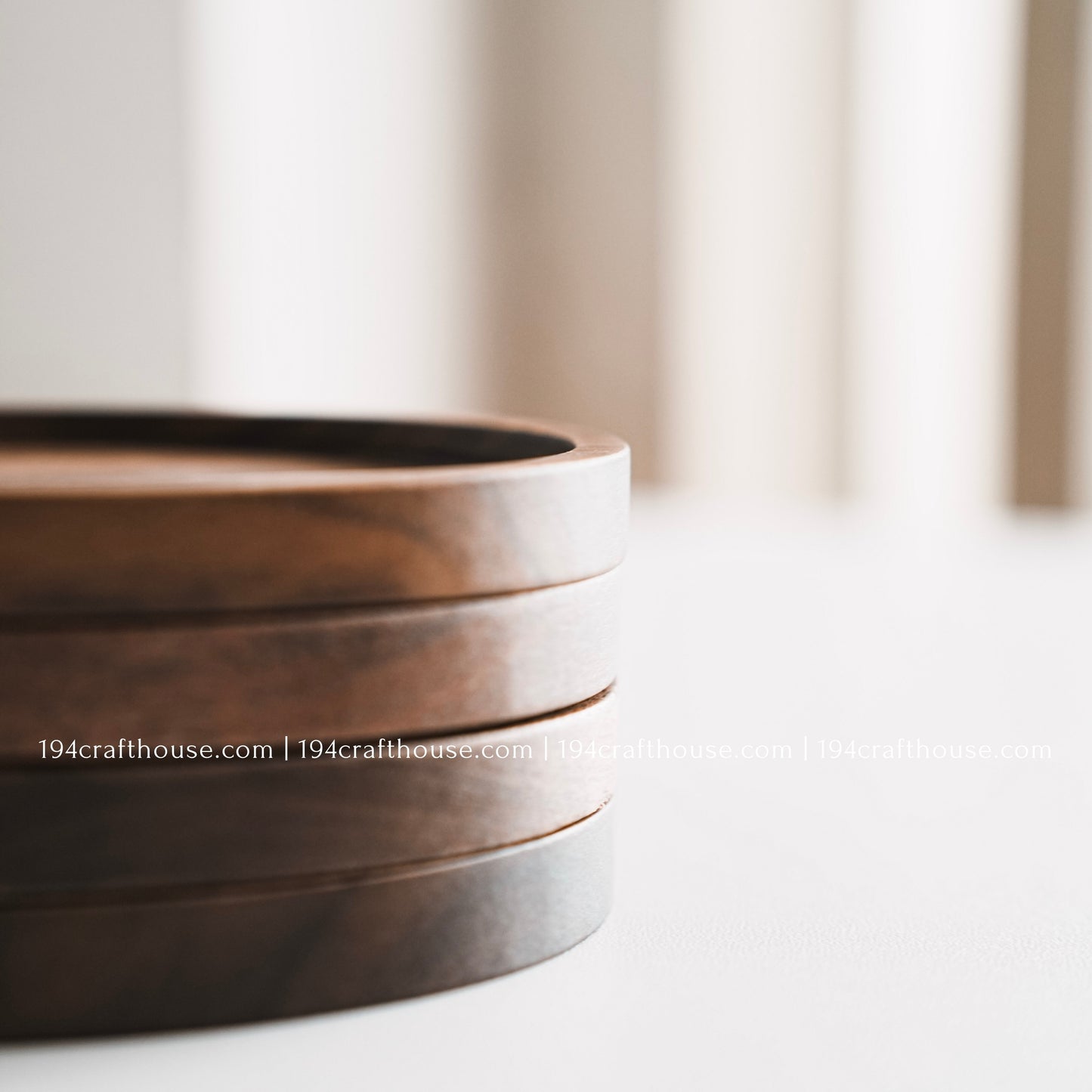 Set of 4 solid walnut drink coaster showcasing a smooth sunken center and rich dark wood grain on a clean white background by 194 Craft House.
