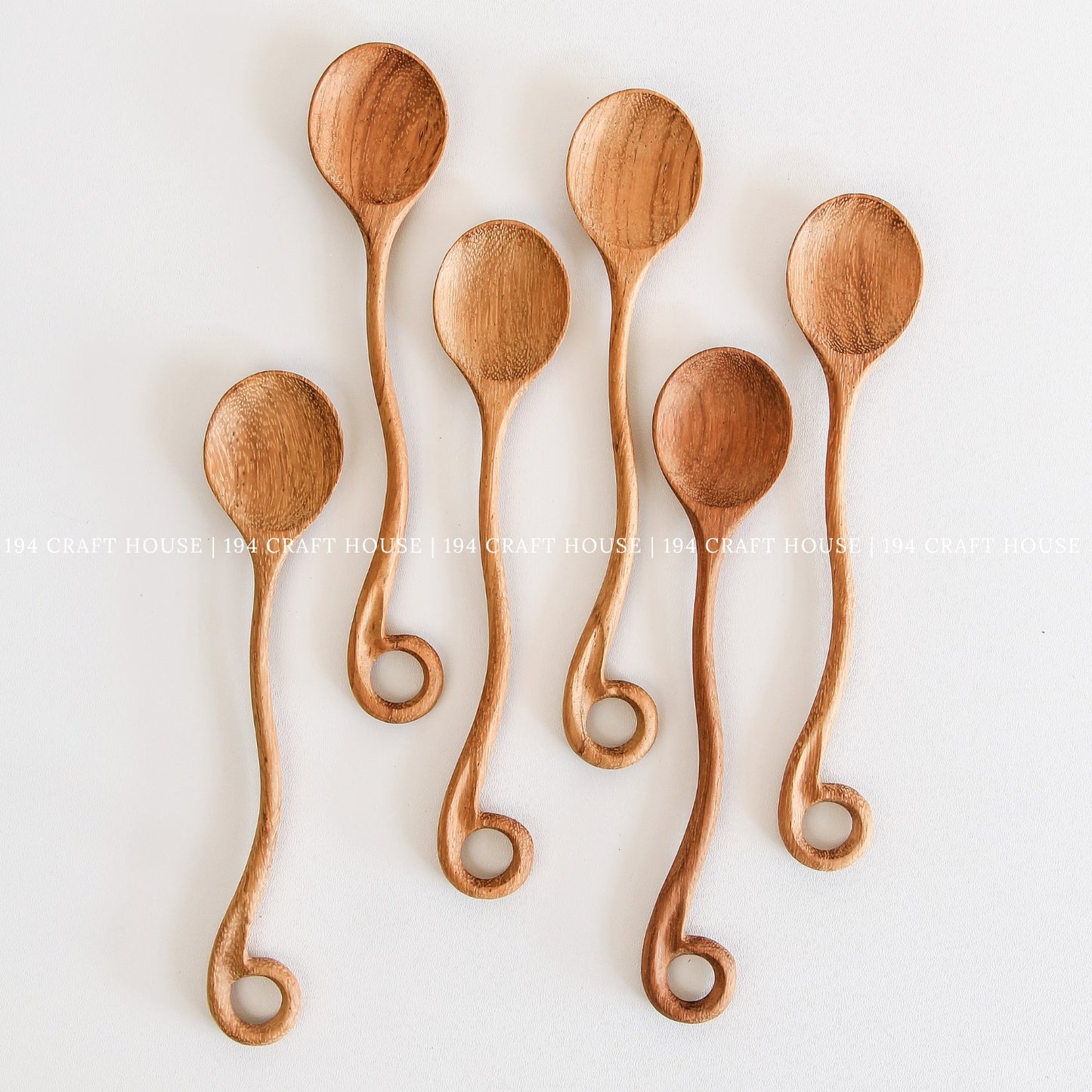 This handcrafted wooden spoon with a hole is a kitchen cooking utensil from 194 Craft House, shown here in another product photo.
