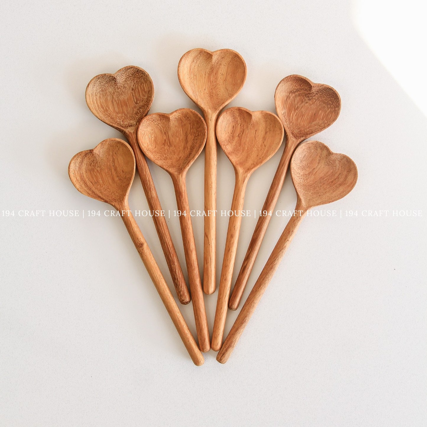 Collection of heart-shaped wooden spoons for personalized gifts and kitchen decor