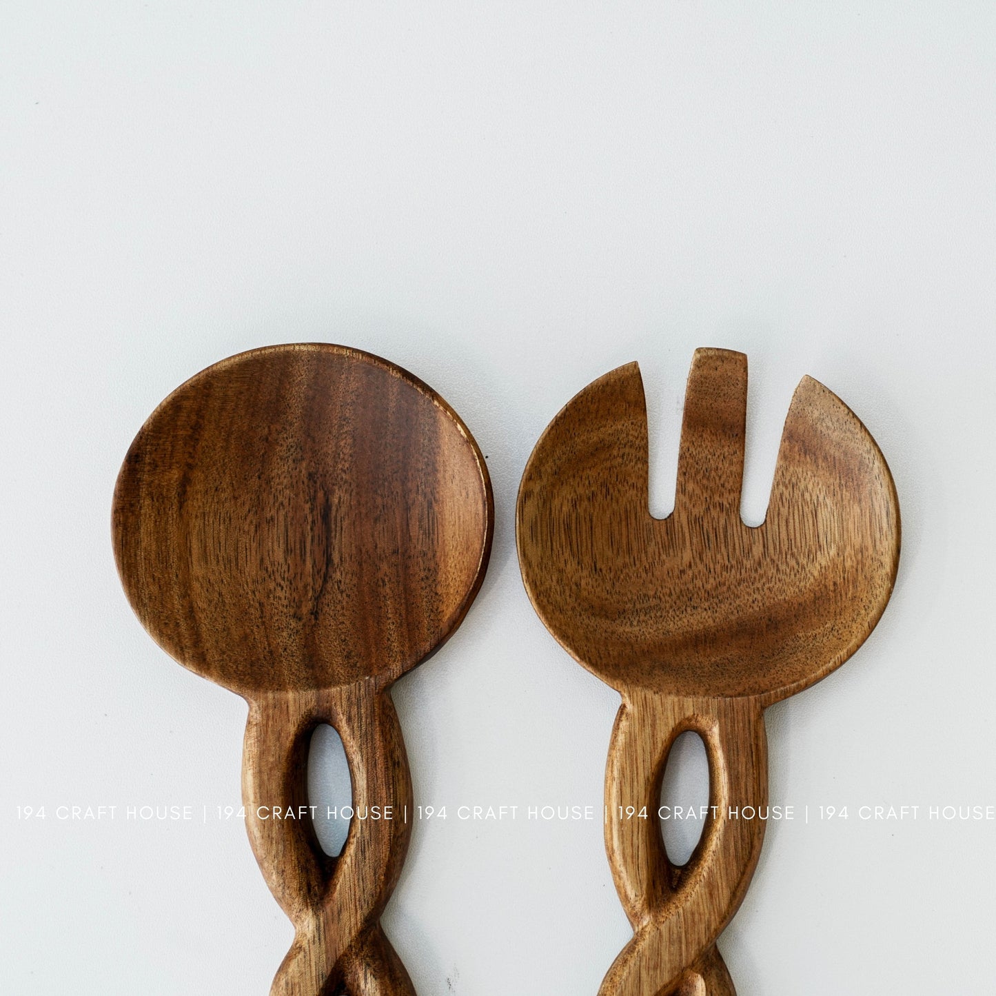 Handcrafted wooden salad servers showcasing smooth finish and natural wood grain