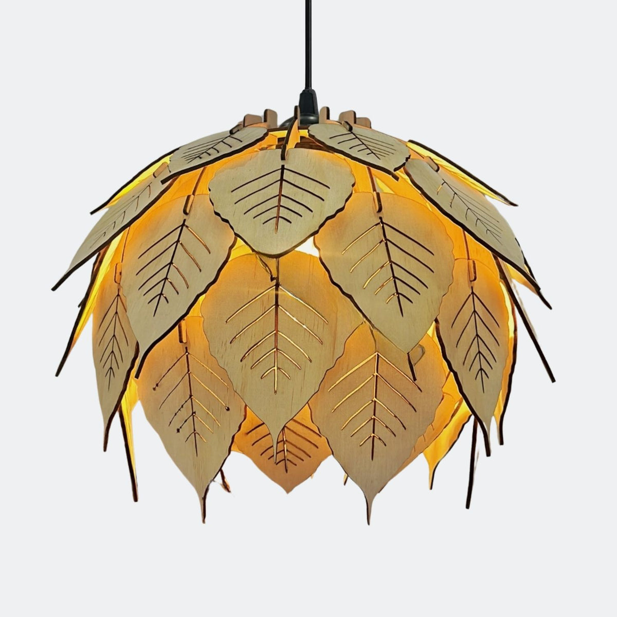 Close-up of layered wooden leaf pieces and carved vein details on lamp shade