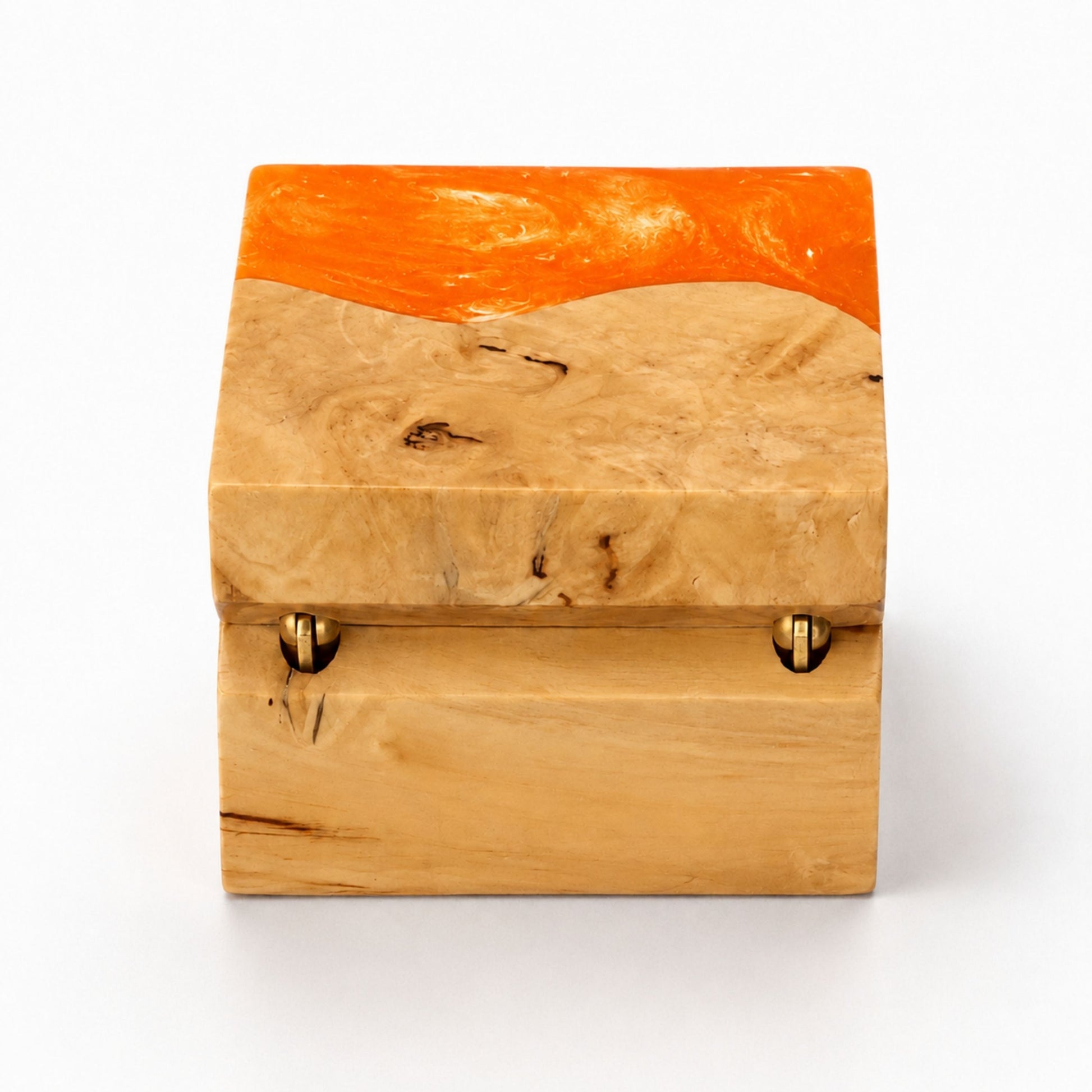 Hinge side back view of a square handcrafted ring box made of orange resin and natural burl wood.