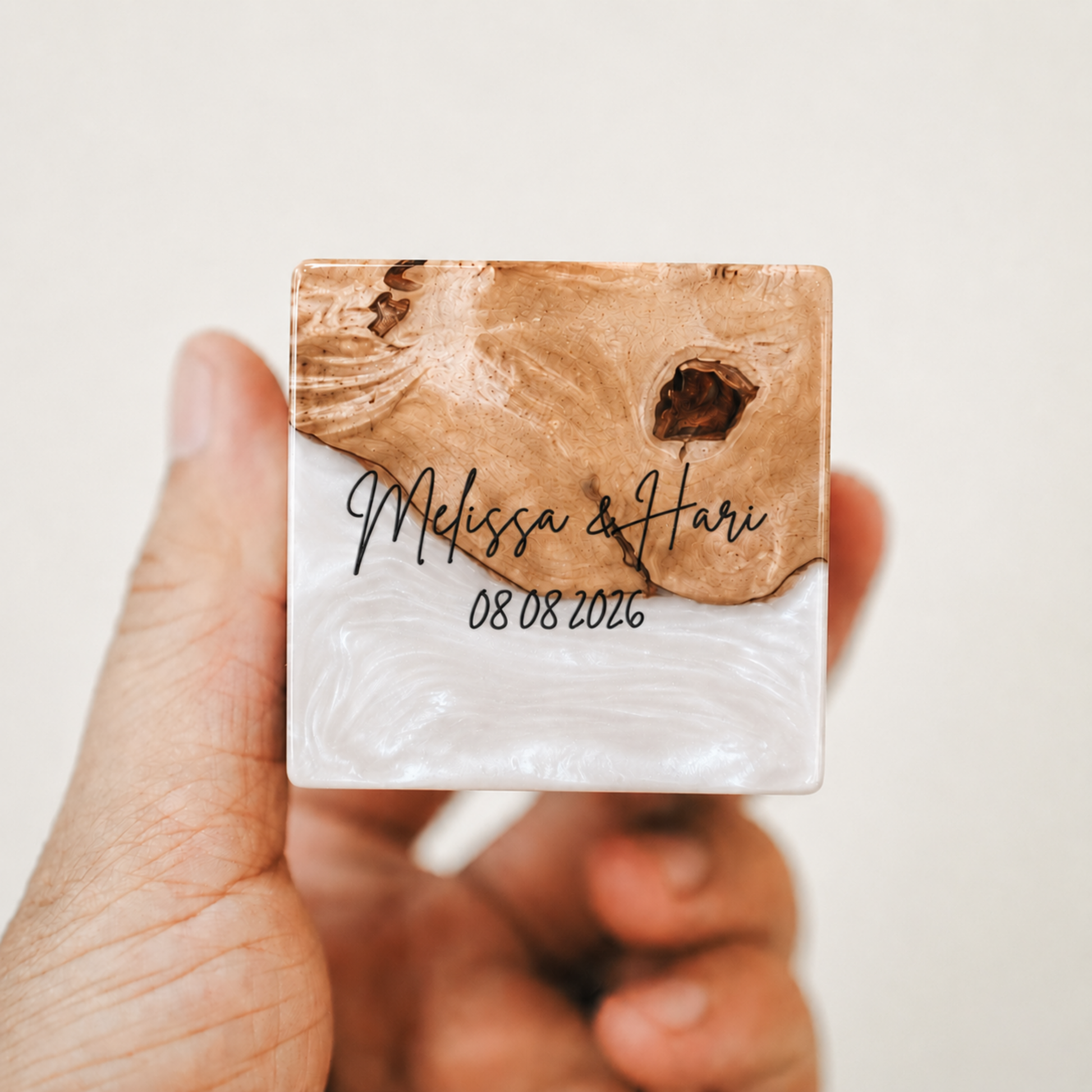 Custom engraved artisan ring box made of pearl epoxy resin and wood, showcasing a personalized name and date engraving