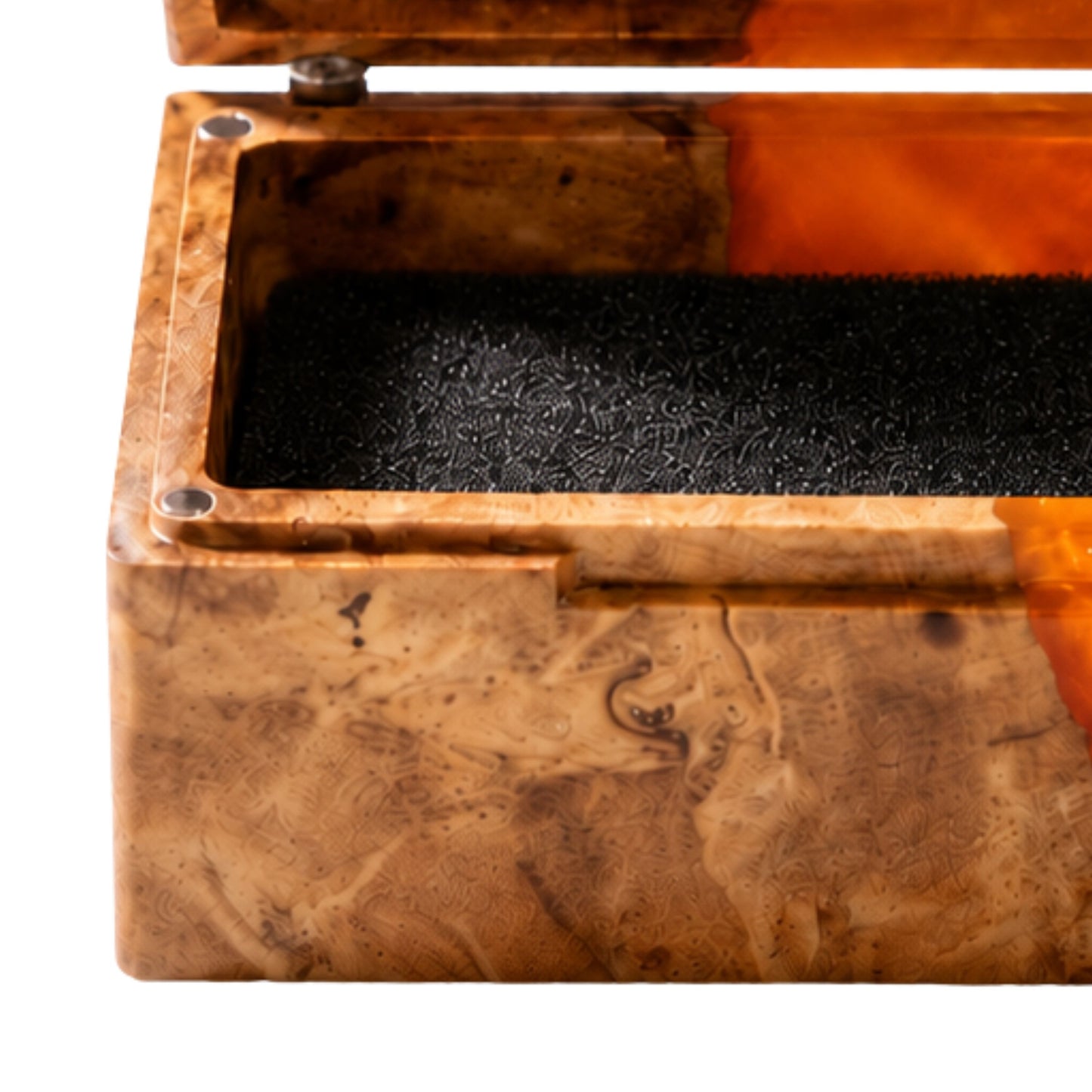 Close-up shot of an engagement ring cushioned inside an open burl wood and orange epoxy resin ring box.
