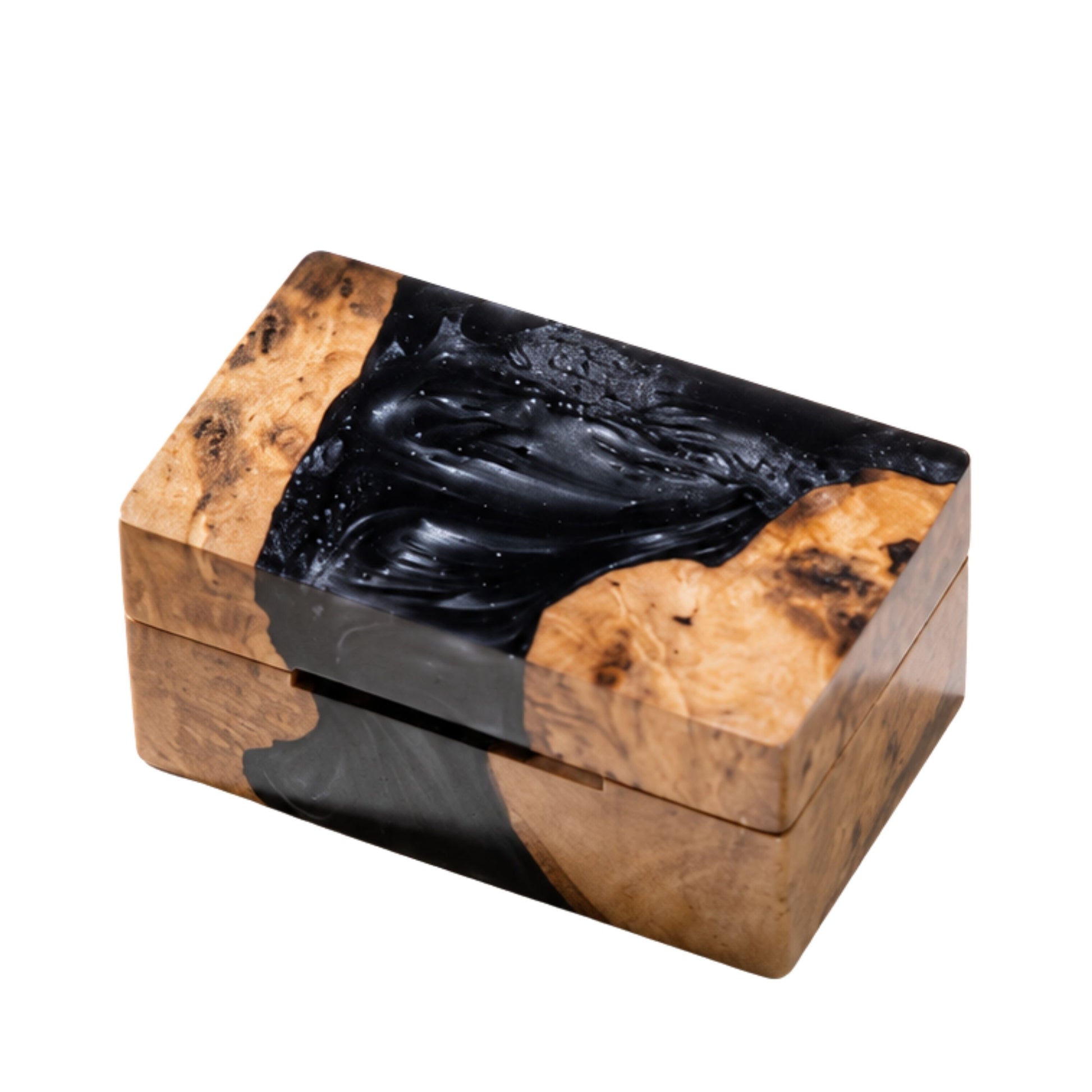Top view of a closed rectangular ring box made from natural burl wood and swirled black epoxy resin.
