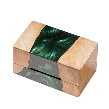 Top view of a closed rectangular ring box made from natural burl wood and swirled emerald green epoxy resin.
