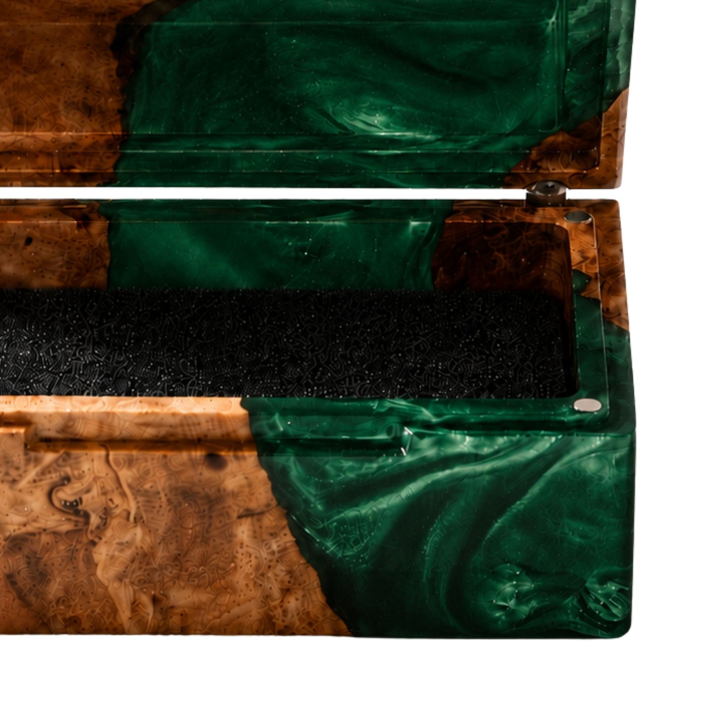 Close-up shot of an engagement ring cushioned inside an open burl wood and emerald green epoxy resin ring box.
