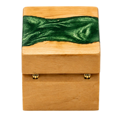 Back view of a wooden ring box featuring gold hinges and an emerald green resin river design across the top lid.
