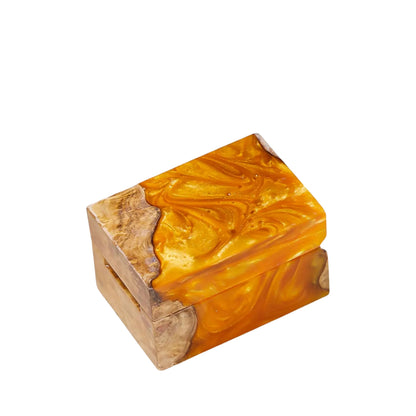 Closed handcrafted amber orange swirl resin and natural wood ring box showcasing a smooth polished surface.