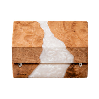 Back view of a closed wood and white pearl epoxy resin ring box showing the gold metal hinges and natural wood grain texture.
