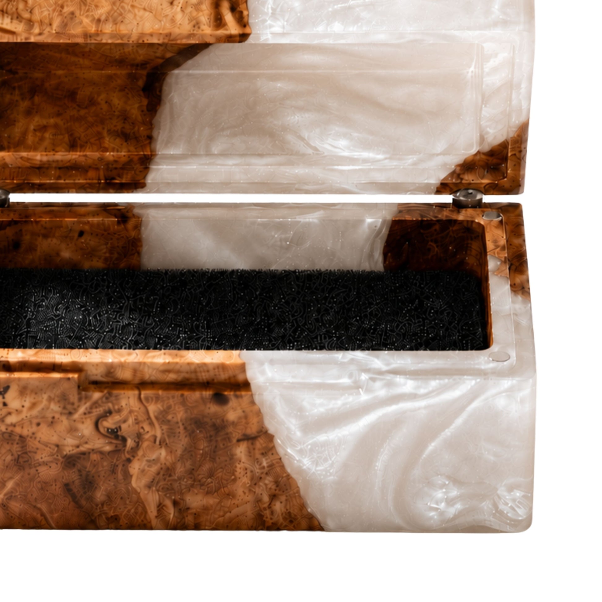Close-up shot of an engagement ring cushioned inside an open burl wood and white pearl epoxy resin ring box.
