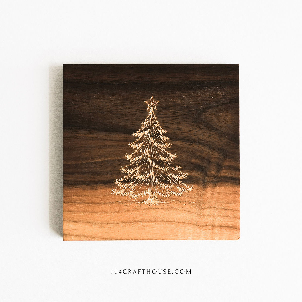 Handmade walnut wood coaster with gold-painted Christmas tree engraving, square shape