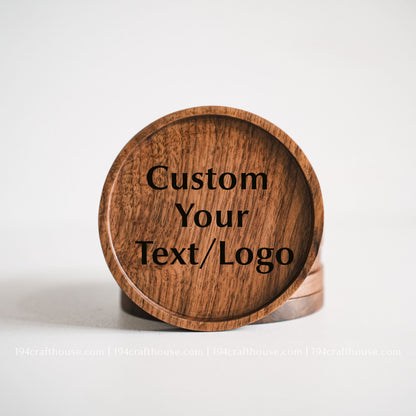 Single solid walnut drink coaster showcasing a smooth sunken center and rich dark wood grain on a clean white background by 194 Craft House.