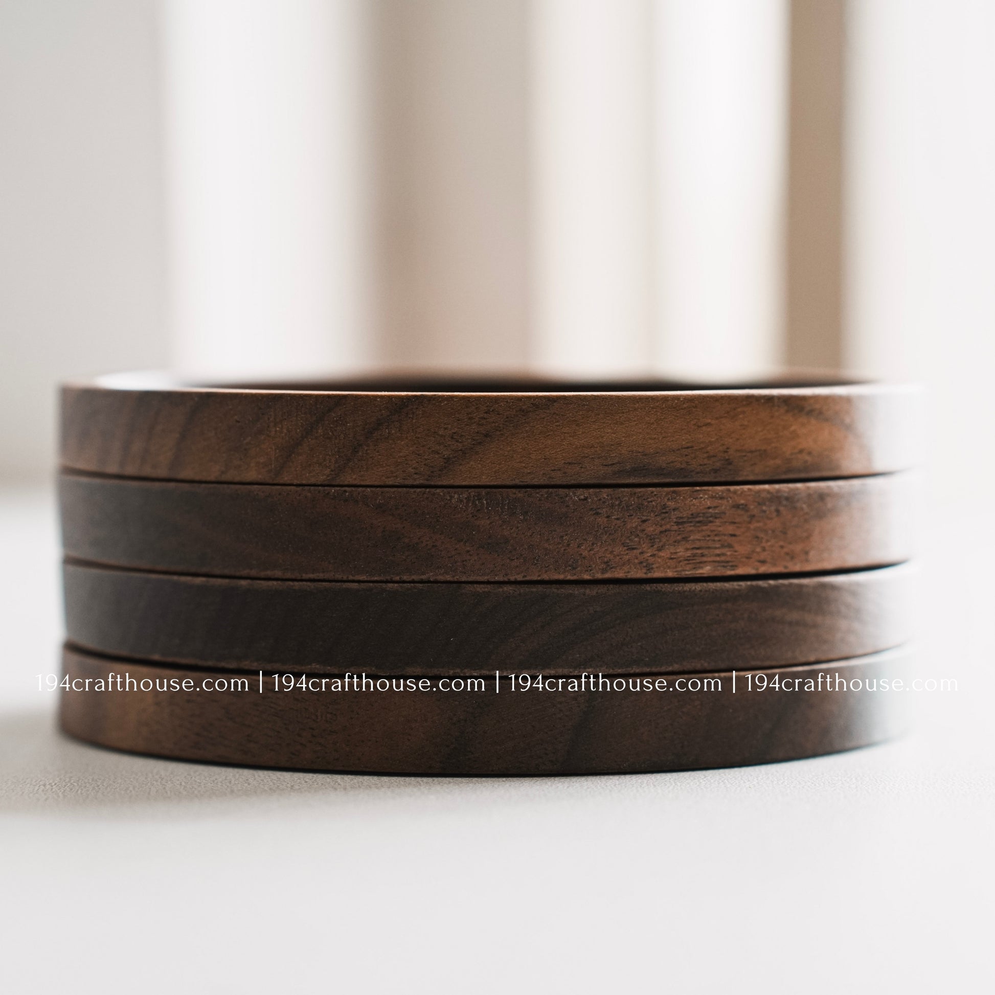Set of 4 solid walnut drink coaster showcasing a smooth sunken center and rich dark wood grain on a clean white background by 194 Craft House.