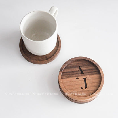 Coffee cup displayed on a handcrafted round walnut wood coaster with rich natural wood grain