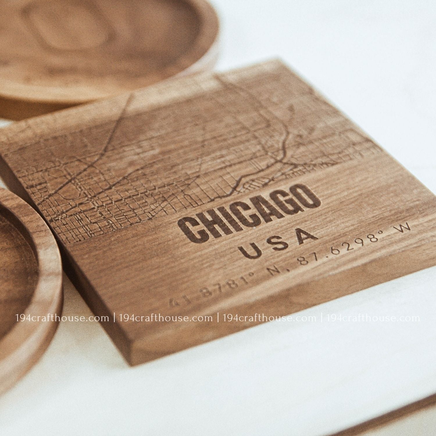 Wooden coaster with engraved map and 'Chicago USA' text on a white surface