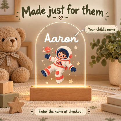 Personalization graphic shows the name Aaron on the astronaut light and invites shoppers to enter a child's name at checkout.