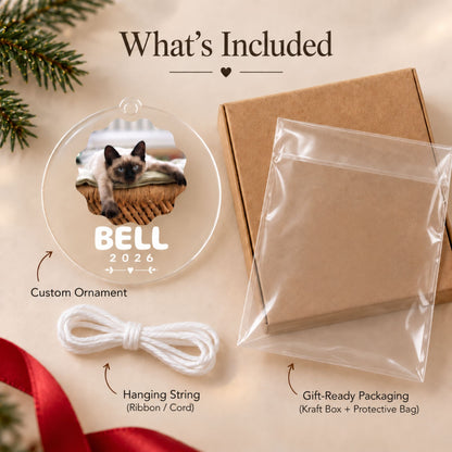 Component overview showing the custom acrylic ornament, bundled white hanging cord, protective sleeve, and kraft gift box.