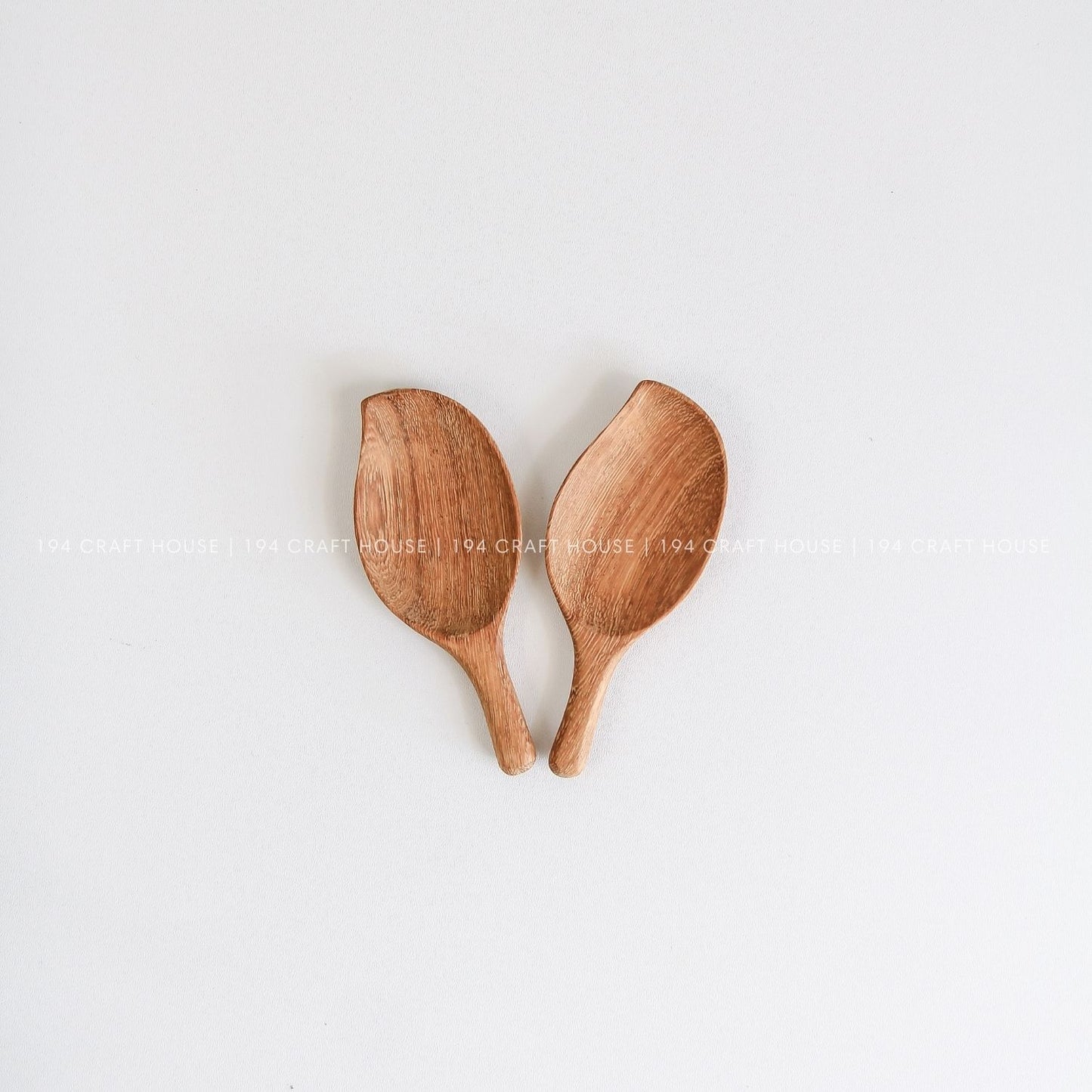 Pair of small handcrafted leaf-shaped wooden scoops for spices, coffee, tea, and dry ingredients