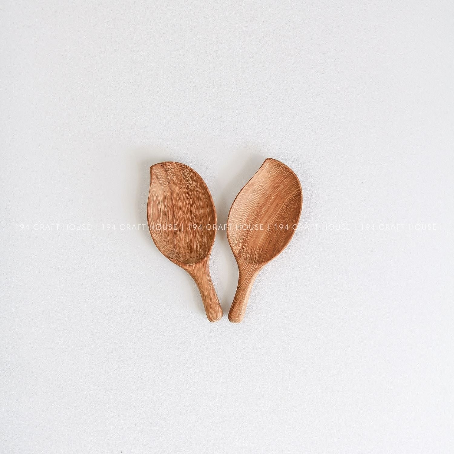 Pair of small handcrafted leaf-shaped wooden scoops for spices, coffee, tea, and dry ingredients