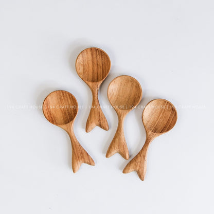 Collection of handcrafted fishtail-shaped small wooden spoons with unique natural grain variations