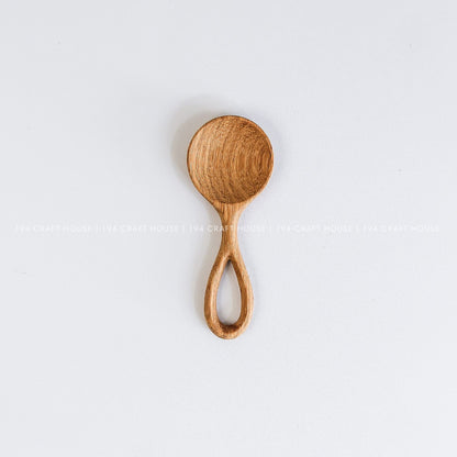 Handmade small wooden scoop for coffee, tea, spices, sugar, and dry ingredients with natural wood grain