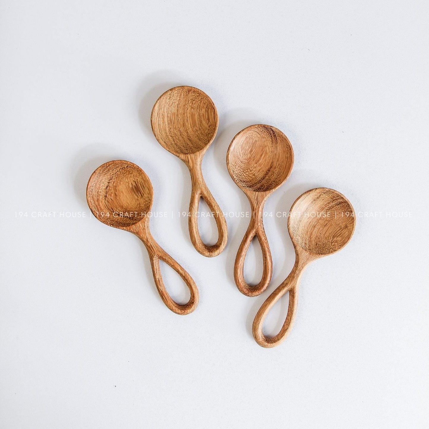 Handmade small wooden scoops showcasing smooth finishes and beautiful natural wood grain