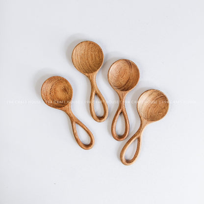 Handmade small wooden scoops showcasing smooth finishes and beautiful natural wood grain