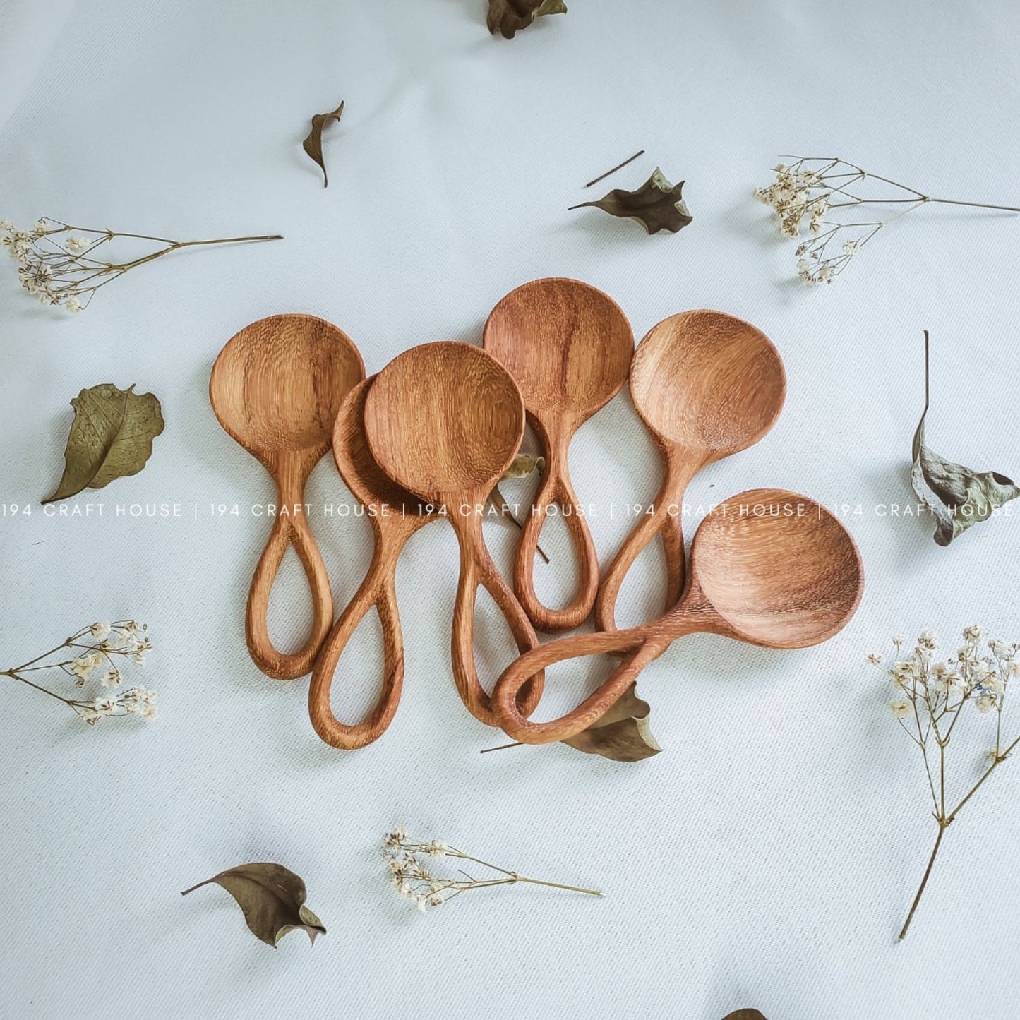 Collection of handmade small wooden scoops for coffee, tea, spices, and kitchen use