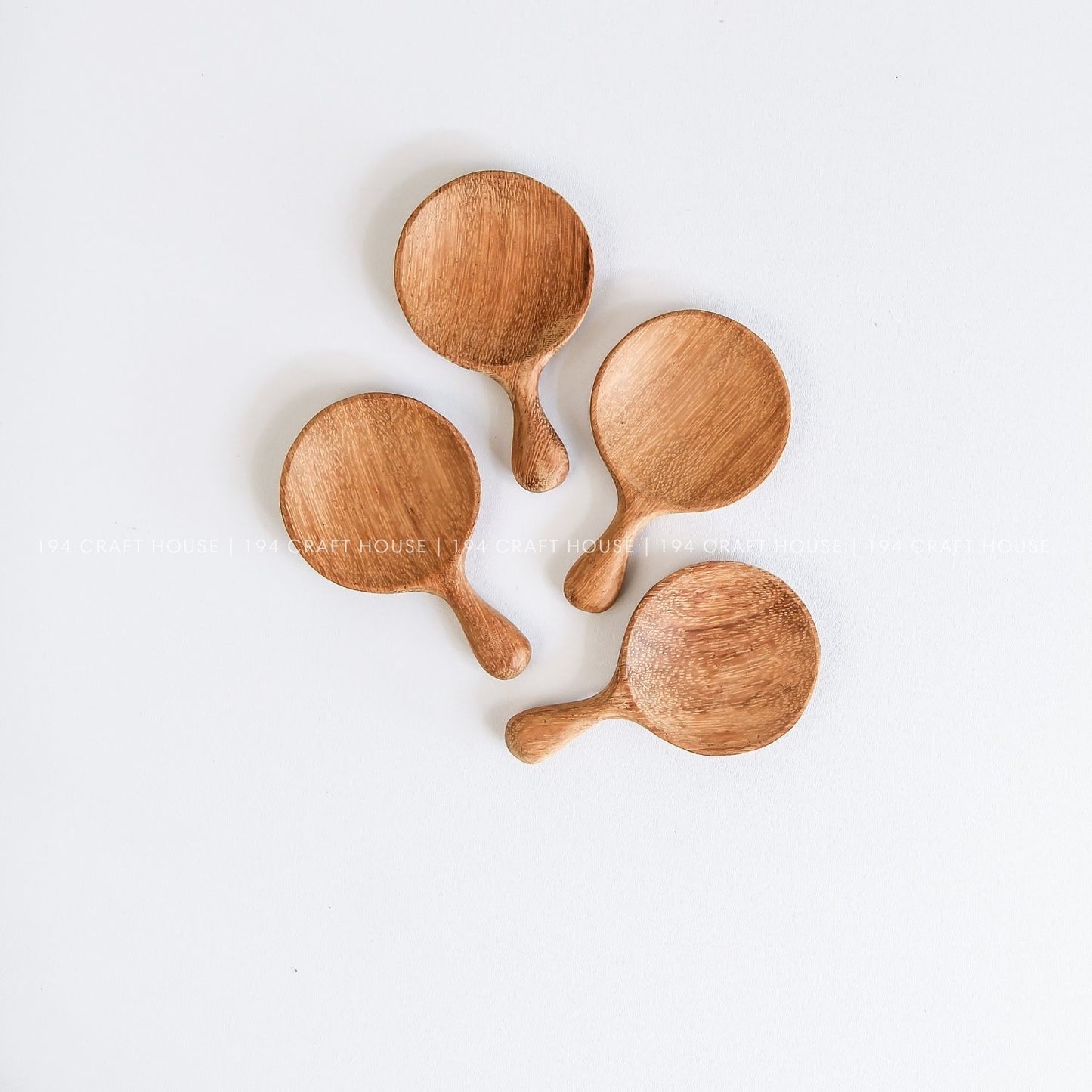 Collection of handmade wooden tea caddy spoons with natural wood grain, ideal for tea lovers and personalized gifts