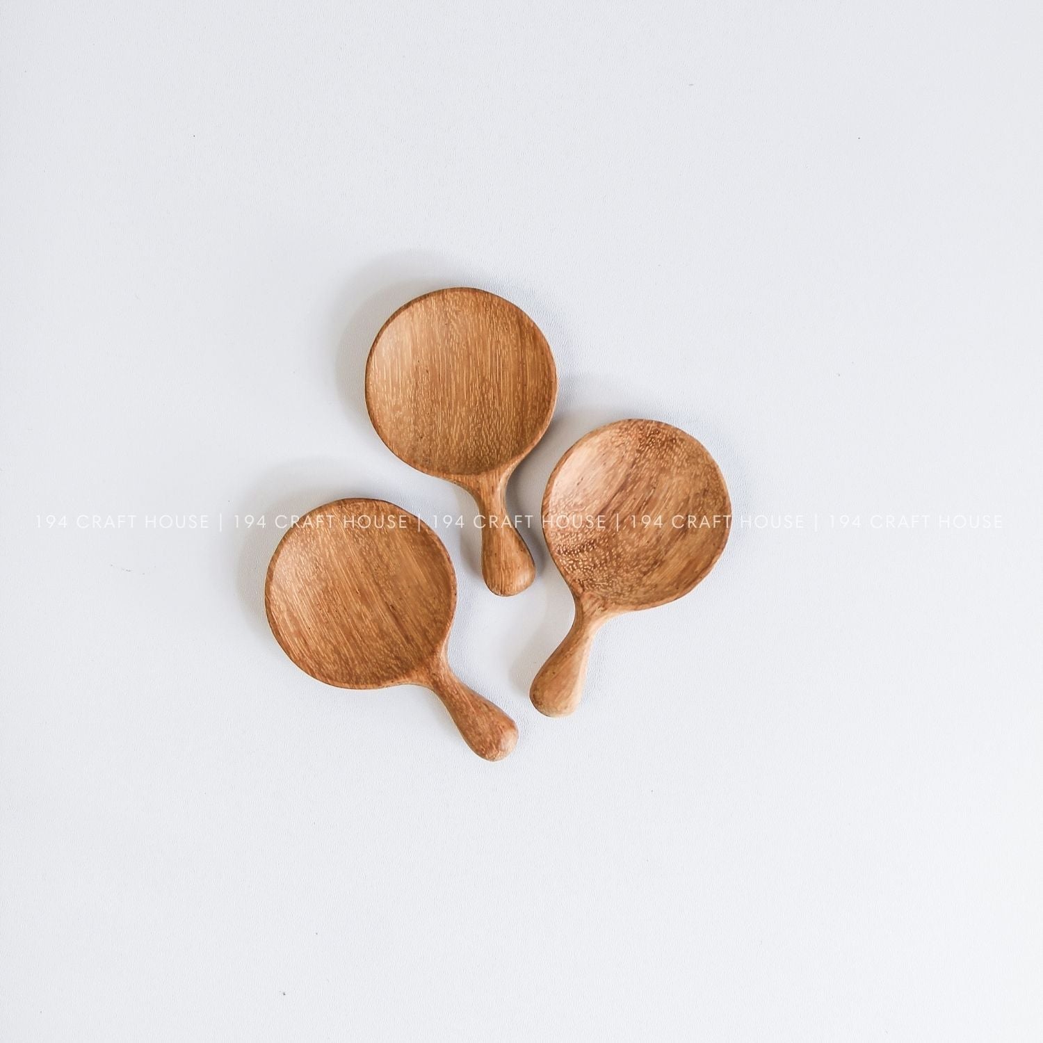 Handmade wooden tea caddy spoons showcasing smooth finishes and unique natural wood grain