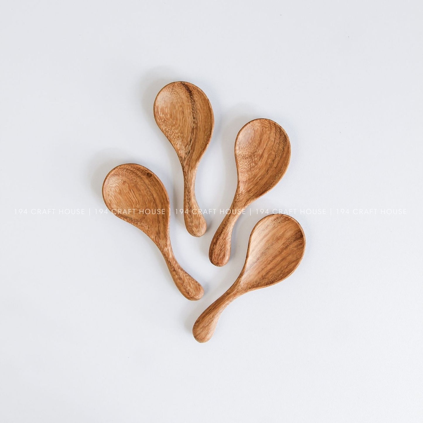 Collection of hand-carved wooden spoons with curved short handles for tea, coffee, spices, and serving