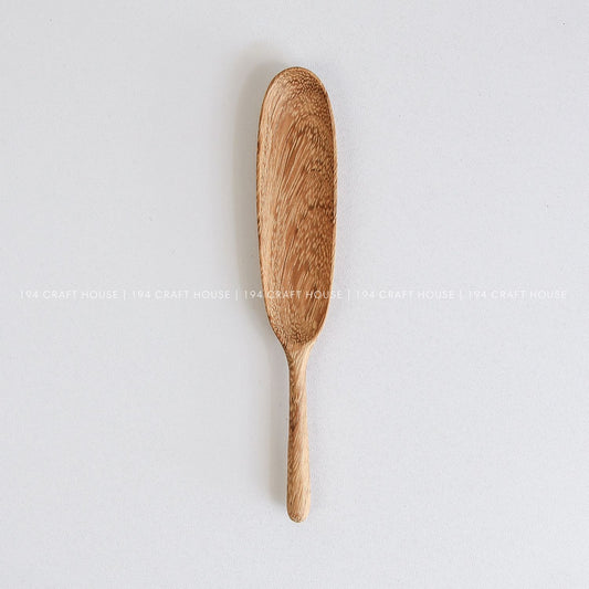 Handcrafted long-handle wooden measuring spoon for spices, herbs, coffee, tea, and dry ingredients with natural wood grain