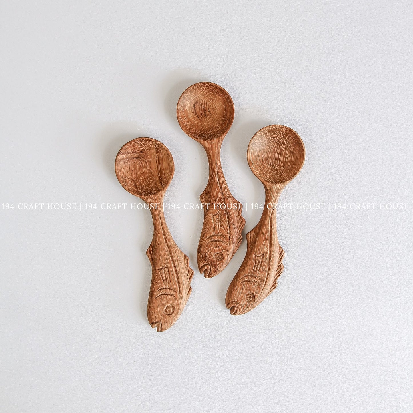 Collection of handcrafted fish-shaped wooden measuring spoons for coffee, tea, herbs, and spices