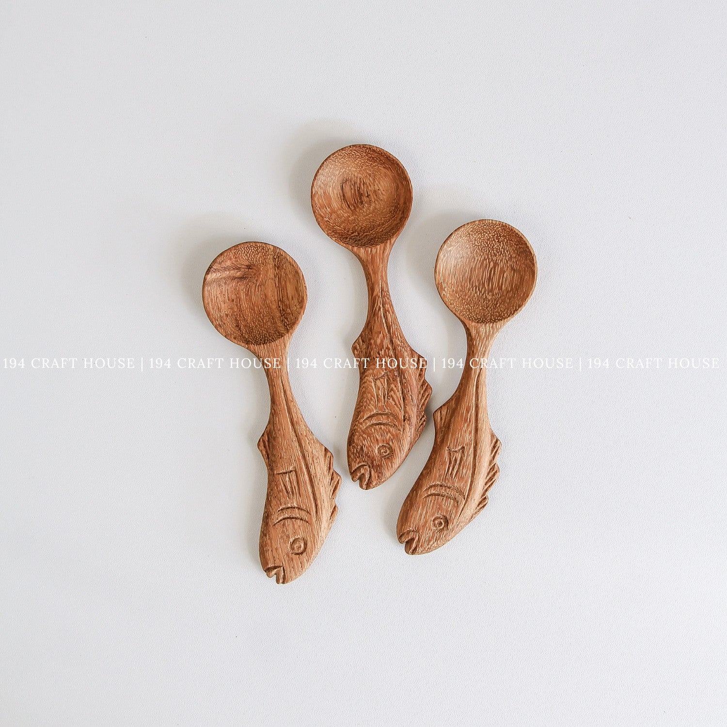 Collection of handcrafted fish-shaped wooden measuring spoons for coffee, tea, herbs, and spices