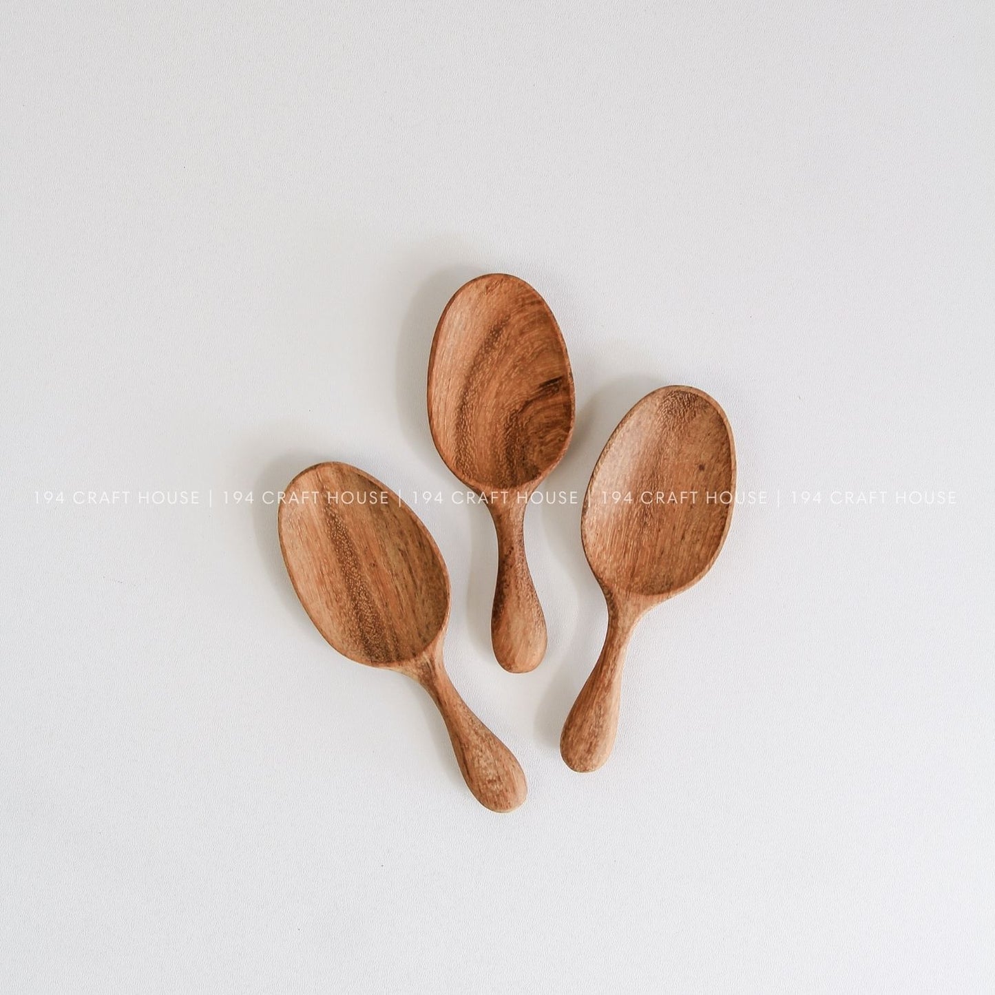 Handcrafted mini wooden spice spoons showcasing beautiful natural wood grain and smooth finish