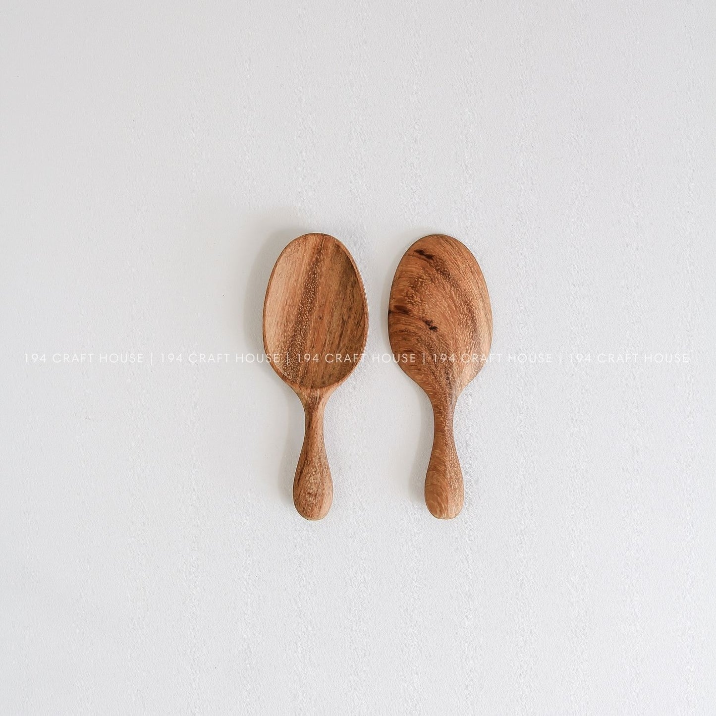 Set of two handcrafted mini wooden spice spoons with smooth natural wood grain
