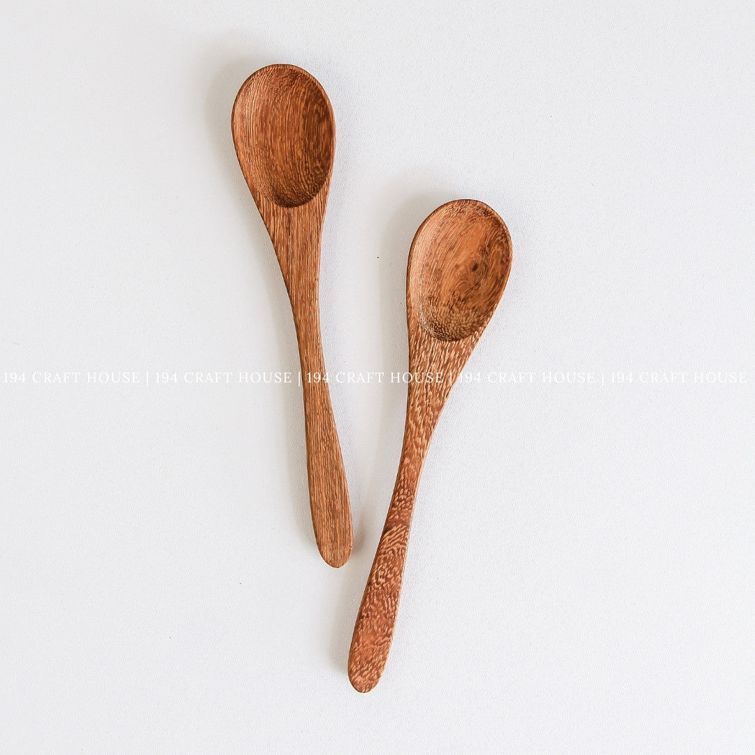 Two handcrafted wooden coffee and tea measuring spoons showcasing beautiful natural wood grain