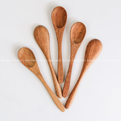Collection of handcrafted wooden coffee and tea measuring spoons with smooth artisan finish