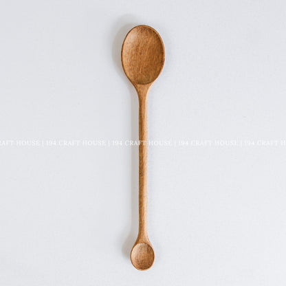 Handcrafted double-ended wooden spoon with large and small spoon bowls