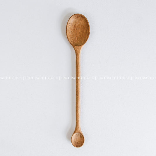 Handcrafted double-ended wooden spoon with large and small spoon bowls