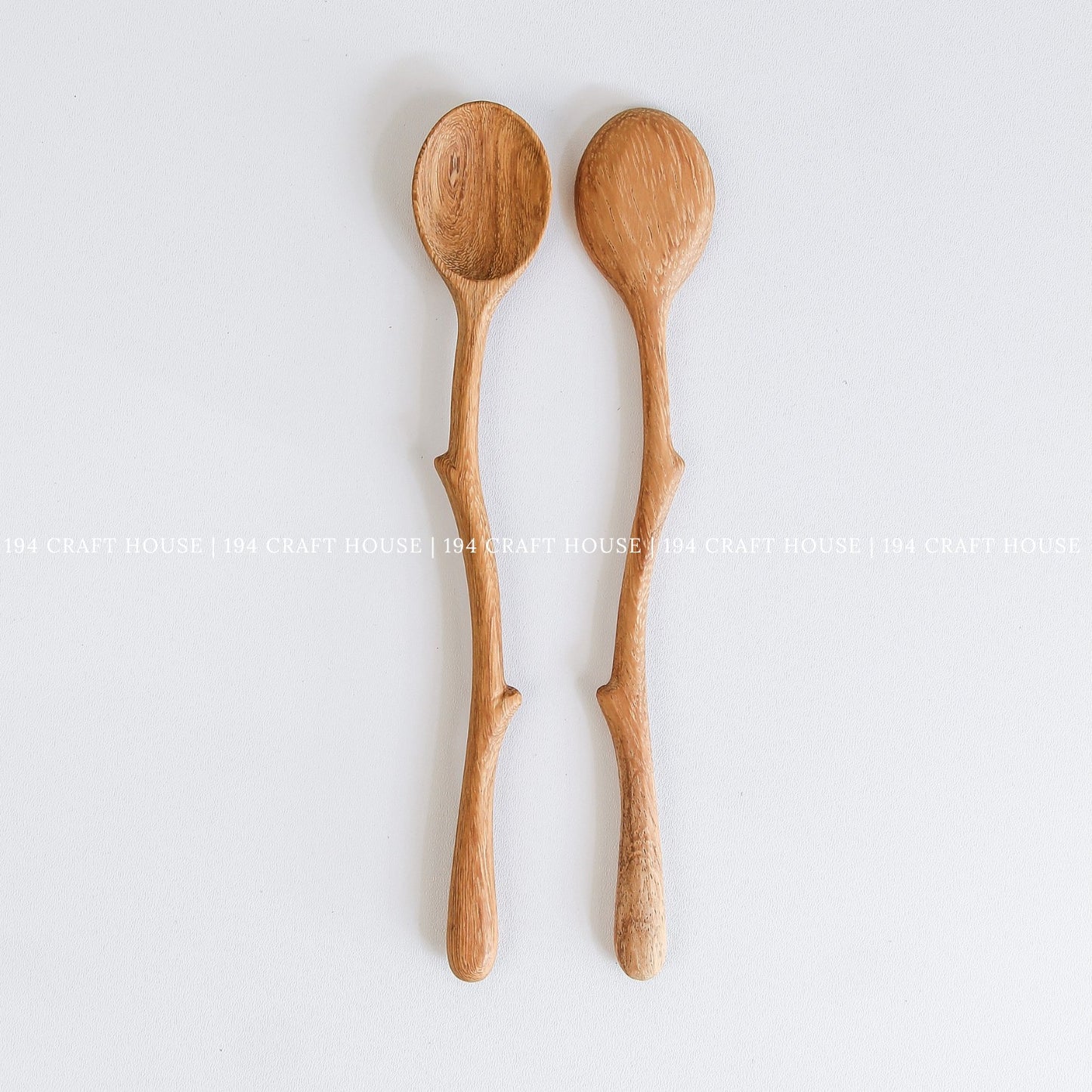 Pair of handcrafted branch handle wooden coffee spoons with natural wood grain