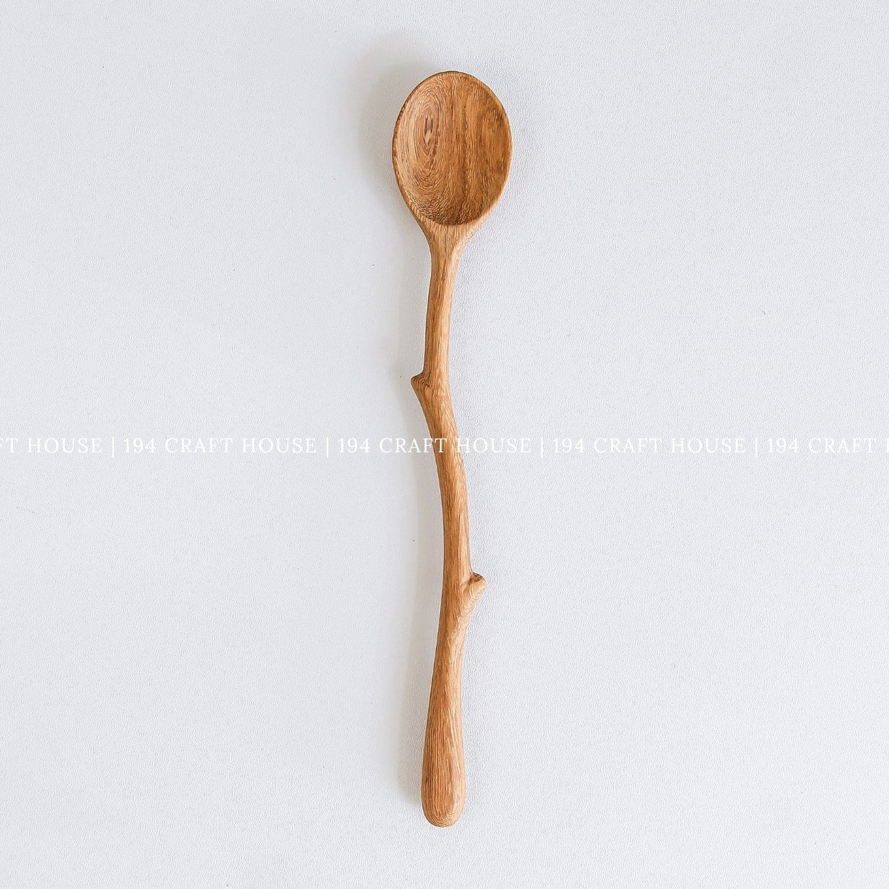 Handcrafted branch handle wooden coffee spoon with a smooth oval bowl