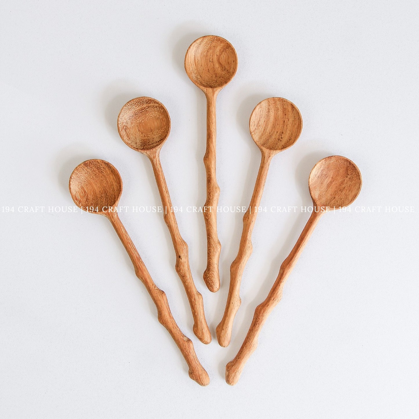 Assorted handcrafted branch tree wooden spoons for cooking, serving, and kitchen decor