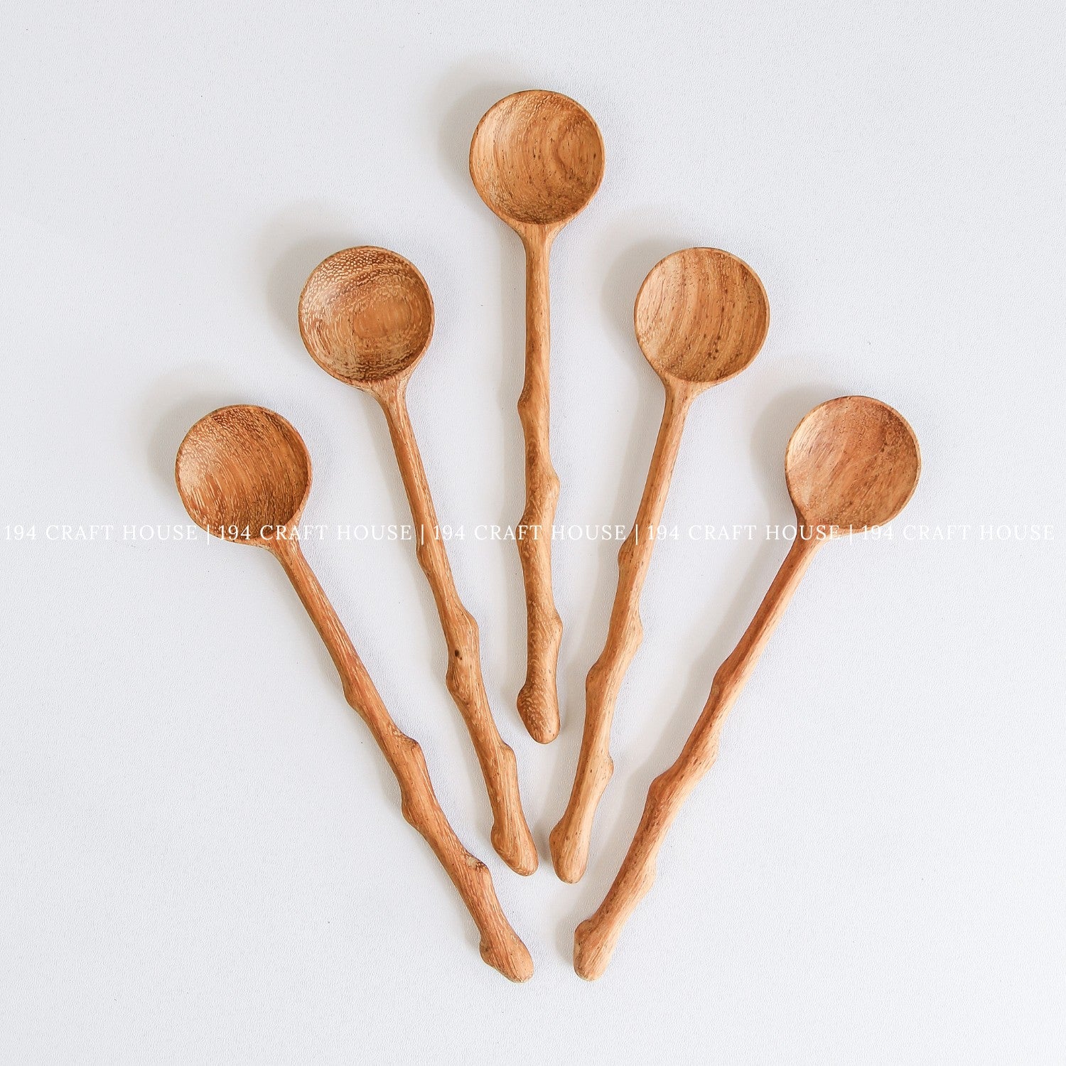 Assorted handcrafted branch tree wooden spoons for cooking, serving, and kitchen decor