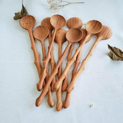 Collection of handcrafted branch tree wooden spoons showcasing natural wood grain and artisan craftsmanship