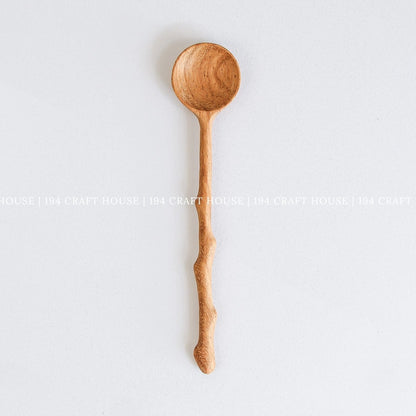 Handcrafted branch tree wooden spoon with a rustic branch-inspired handle and natural wood grain
