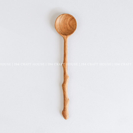 Handcrafted branch tree wooden spoon with a rustic branch-inspired handle and natural wood grain