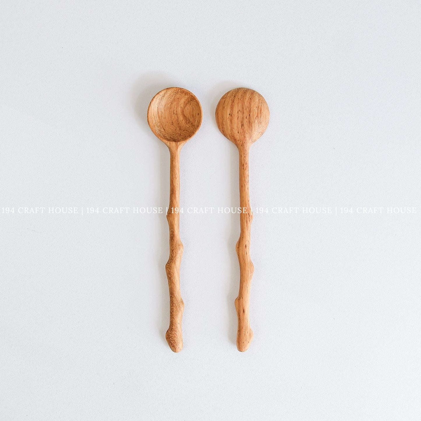 Two handcrafted branch tree wooden spoons with rustic branch-inspired handles