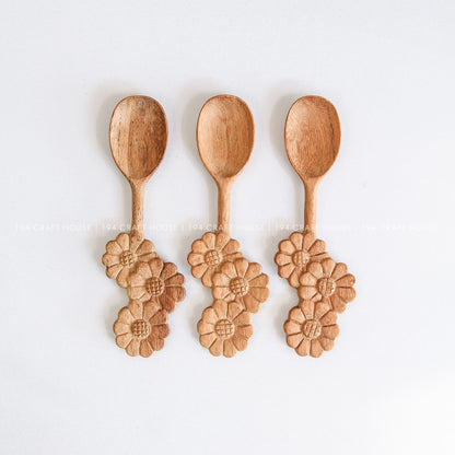Set of three handcrafted wooden spoons with decorative three-flowers handles